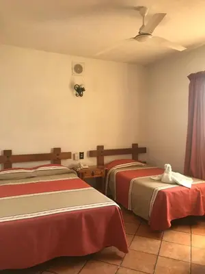 Cama o camas de una habitación en Hotel Colonial Rivera