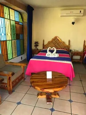 Cama o camas de una habitación en Hotel Colonial Rivera