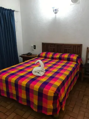 Cama o camas de una habitación en Hotel Colonial Rivera