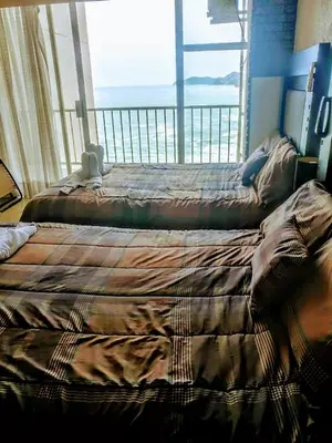 Cama o camas de una habitación en SUITE EN TORRES GEMELAS a pie de playa 1403 N