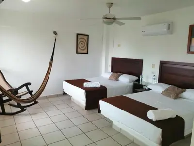 Cama o camas de una habitación en Hotel Arrecife Chachalacas