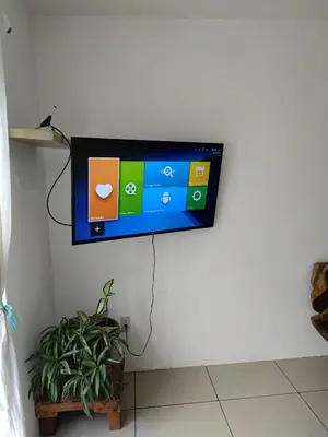 Una televisión o centro de entretenimiento en BRISAMAR GUESTHOUSE