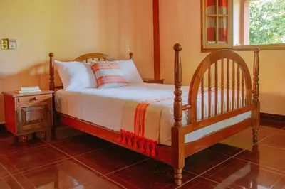 Cama o camas de una habitación en La Casona Hostel
