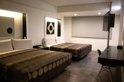 Cama o camas de una habitación en Hotel Harare