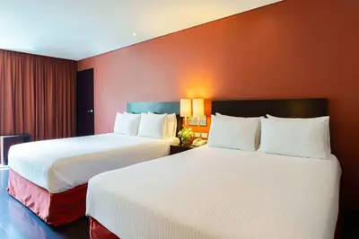 Cama o camas de una habitación en NH Puebla Centro Histórico