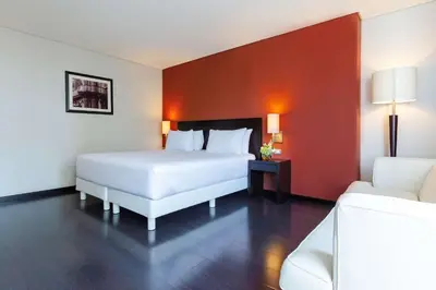 Cama o camas de una habitación en NH Puebla Centro Histórico