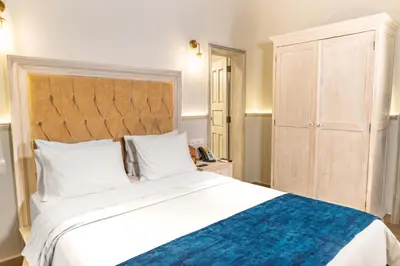 Cama o camas de una habitación en voco Royalty Puebla Downtown by IHG
