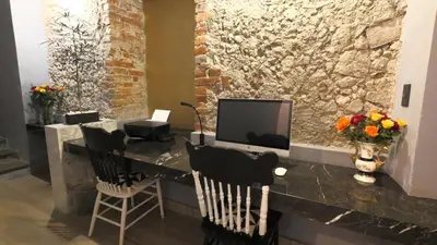 Una televisión o centro de entretenimiento en Alqueria de Carrion Hotel Boutique