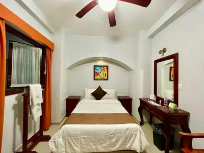 Cama o camas de una habitación en Hotel Puebla Plaza