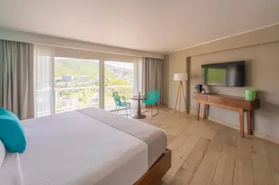 Una televisión o centro de entretenimiento en Hotel Amares Acapulco