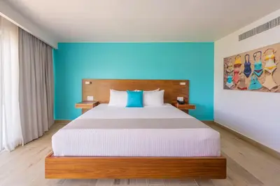 Cama o camas de una habitación en Hotel Amares Acapulco
