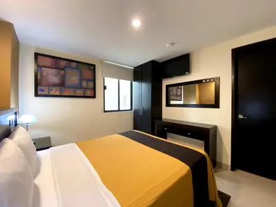 Cama o camas de una habitación en Hotel Escala Puebla Centro