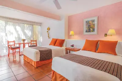 Cama o camas de una habitación en Hotel Racquet Cuernavaca