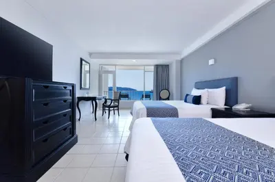 Cama o camas de una habitación en Krystal Beach Acapulco