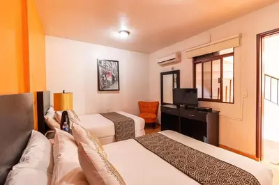 Cama o camas de una habitación en Hotel Doña Juana