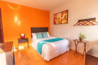Cama o camas de una habitación en Hotel Doña Juana