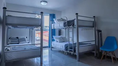 Cama o camas de una habitación en Esencia Hostal Terminal Oaxaca