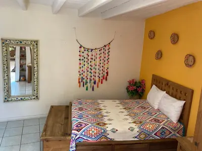 Cama o camas de una habitación en Cálida habitación a 10 min de Santo Domingo
