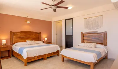 Cama o camas de una habitación en Hotel El Mirador