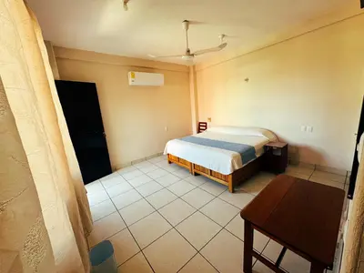 Cama o camas de una habitación en Hotel El Mirador
