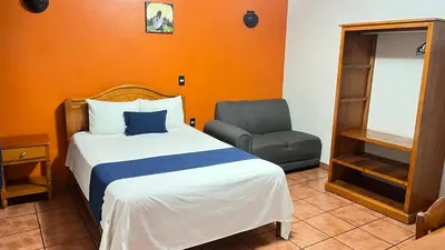 Cama o camas de una habitación en Hotel La Cascada Oaxaca