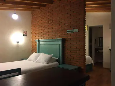 Cama o camas de una habitación en Hacienda Soltepec Suites Campo de Golf