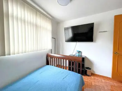 Cama o camas de una habitación en DEPTO FRENTE A ESTADIO GNP ANTES FORO SOL y AUTODROMO F1 A 10 MIN CAMINANDO