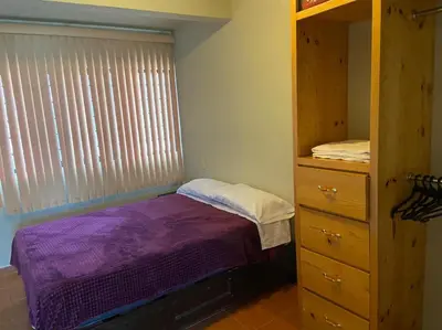 Cama o camas de una habitación en Departamento con gran área verde