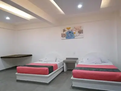 Cama o camas de una habitación en Hotel San Carlos Yautepec