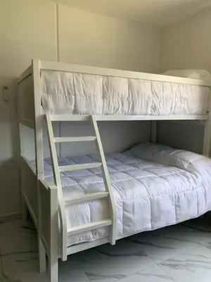 Cama o camas de una habitación en Departamento en Acapulco Diamante