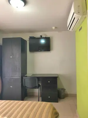 Una televisión o centro de entretenimiento en Hotel Ruah