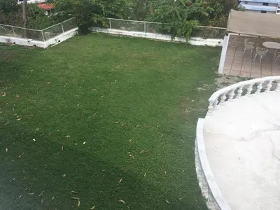 Jardín al aire libre en Casa con vista espectacular al mar con alberca