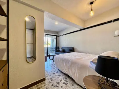 Cama o camas de una habitación en Estacion Alameda Downtown