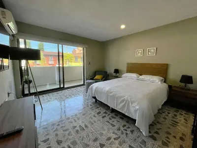 Cama o camas de una habitación en Estacion Alameda Downtown