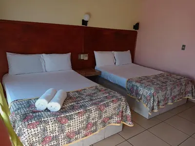 Cama o camas de una habitación en Hotel Casa Juanita