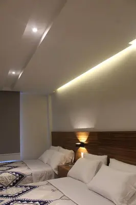 Cama o camas de una habitación en BERTHEL SUITES