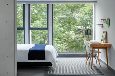 Cama o camas de una habitación en NIU Modern & Centric Lofts