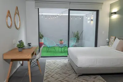 Cama o camas de una habitación en NIU Modern & Centric Lofts