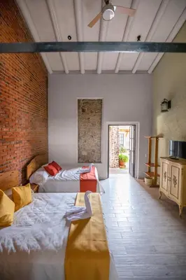 Cama o camas de una habitación en Hacienda Gamboa