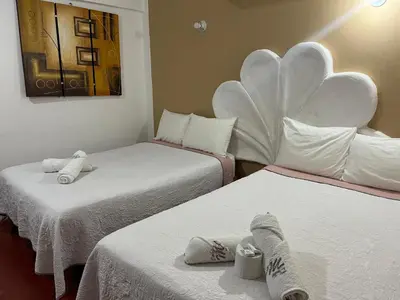 Cama o camas de una habitación en Hotel Doña Mary Huatulco