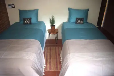 Cama o camas de una habitación en Hotel Bendita Luna