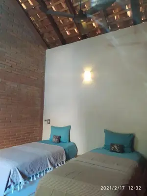 Cama o camas de una habitación en Hotel Bendita Luna
