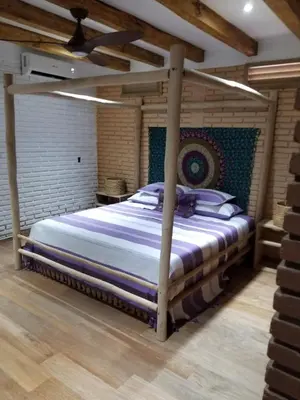 Cama o camas de una habitación en Hotel Bendita Luna