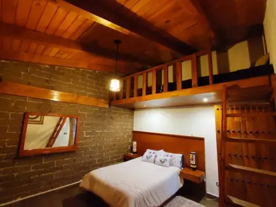 Cama o camas de una habitación en cabaña el rio la grande