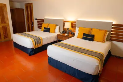 Cama o camas de una habitación en Casa Azulai Puebla Hotel Boutique
