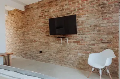 Una televisión o centro de entretenimiento en Villas Colón 18