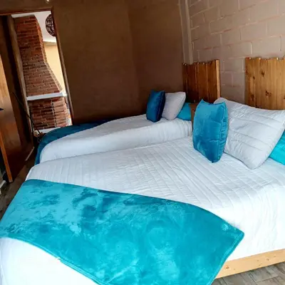 Cama o camas de una habitación en ESTANCIA 360 HERMOSA CABAÑA PARA PAREJA O FAMILIA