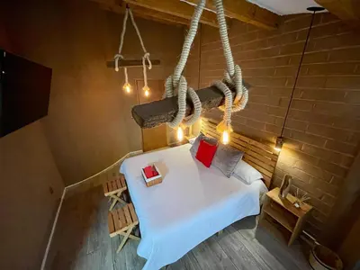 Cama o camas de una habitación en ESTANCIA 360 HERMOSA CABAÑA PARA PAREJA O FAMILIA