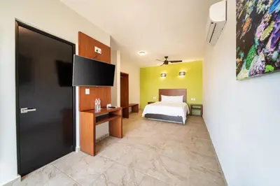 Una televisión o centro de entretenimiento en Villas Coral Huatulco