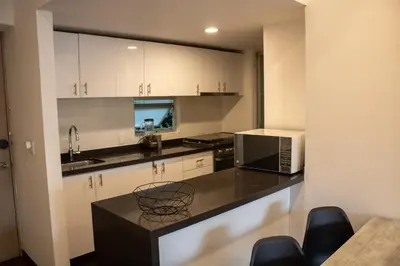 Una cocina o zona de cocina en Condo en Zona de Hospitales Condo en Planta Baja